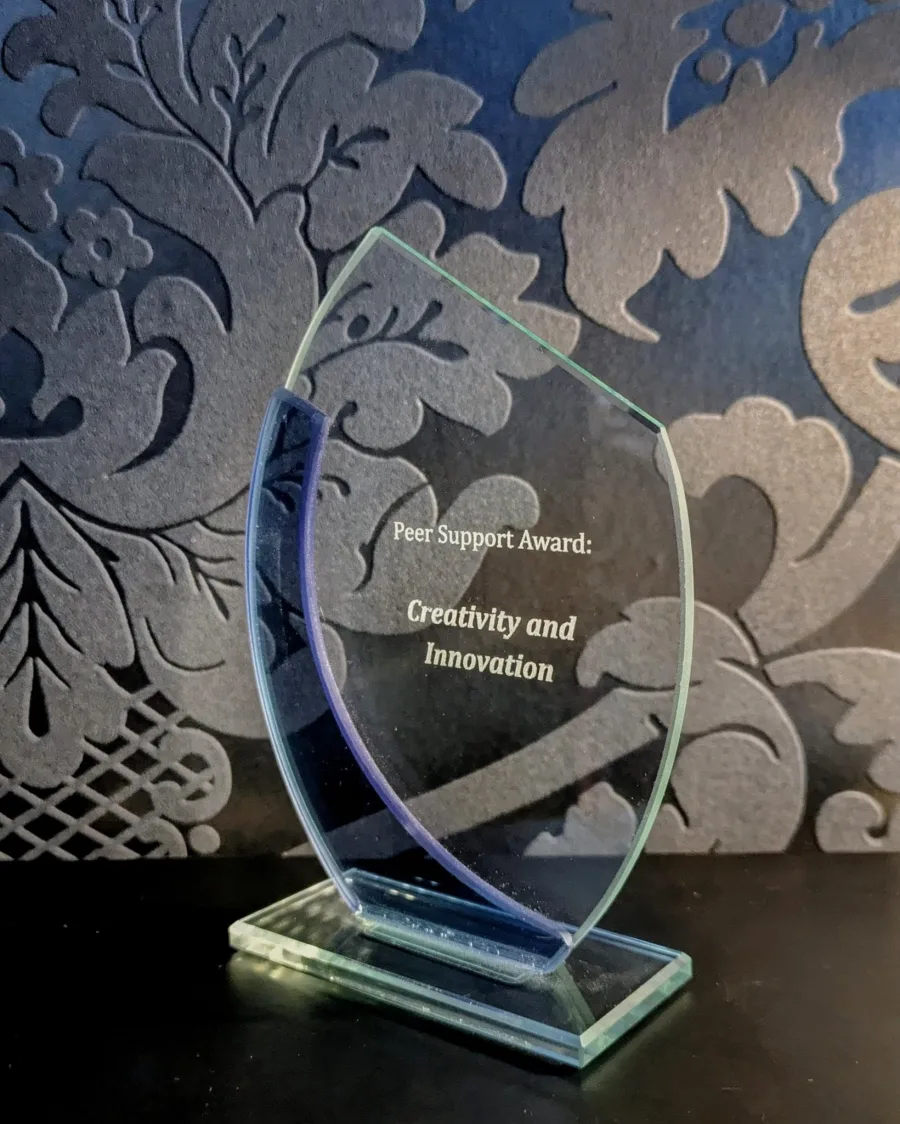 Glass trophy engraved Peer Support Award: Creativity and Innovation