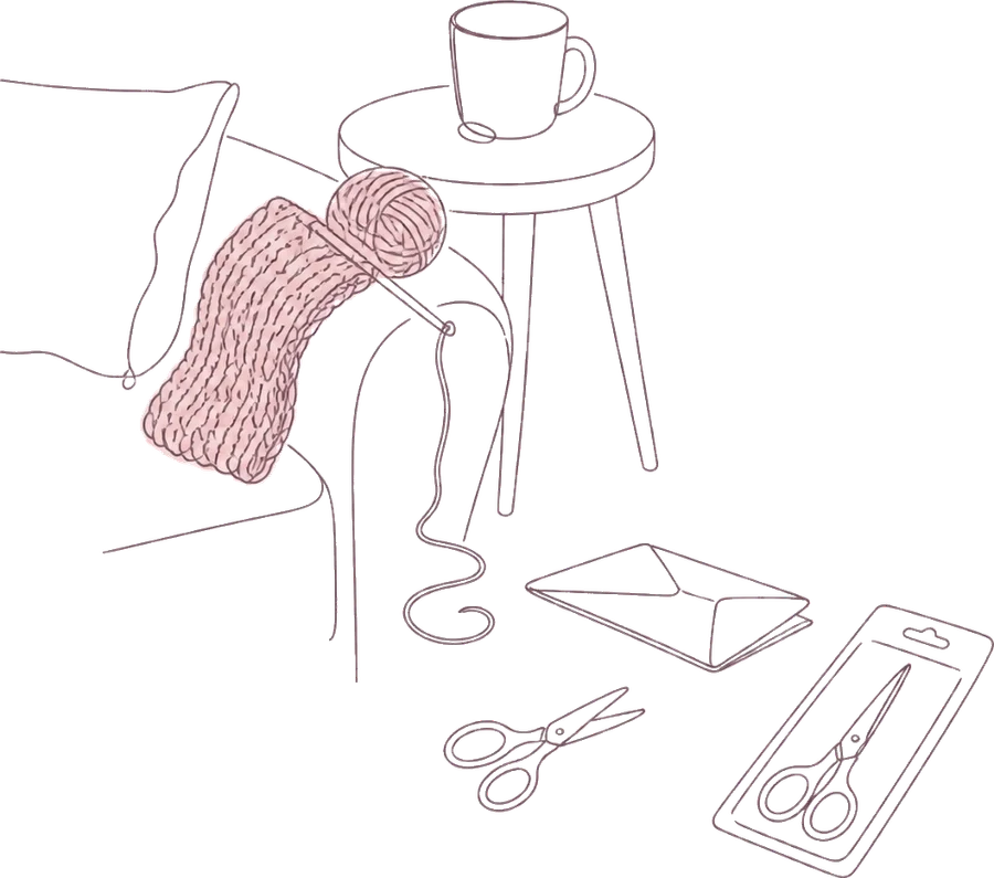 Fine line drawing: a knitting project draped over a sofa arm, a mug on a side table, an envelope, and two pairs of scissors on the floor, one still in its packet